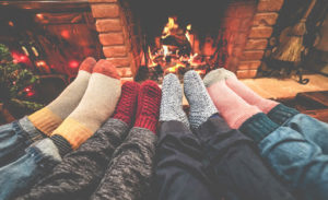 Legs View of Happy Family Lying Down Next Fire Place — Alpine Fireplaces 